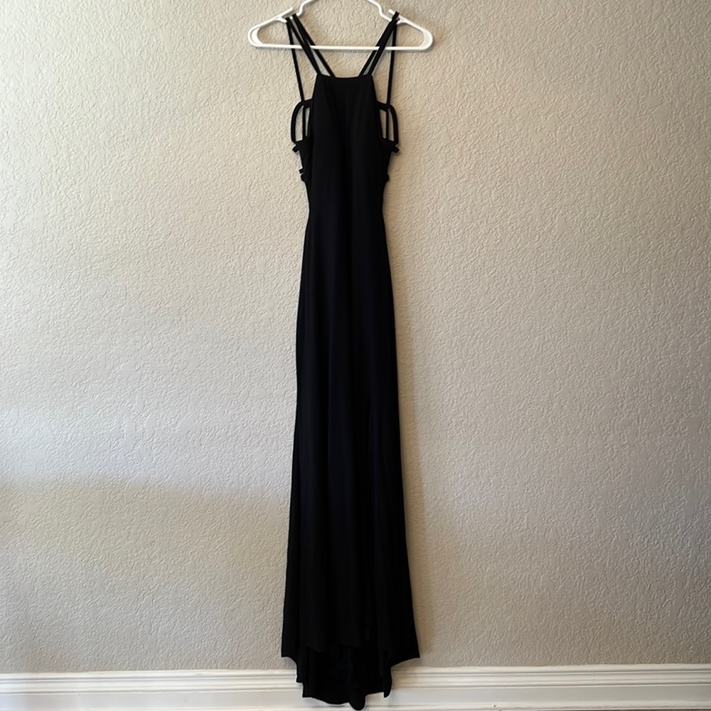 Beautiful sleek black dress with open back and strapped back design.